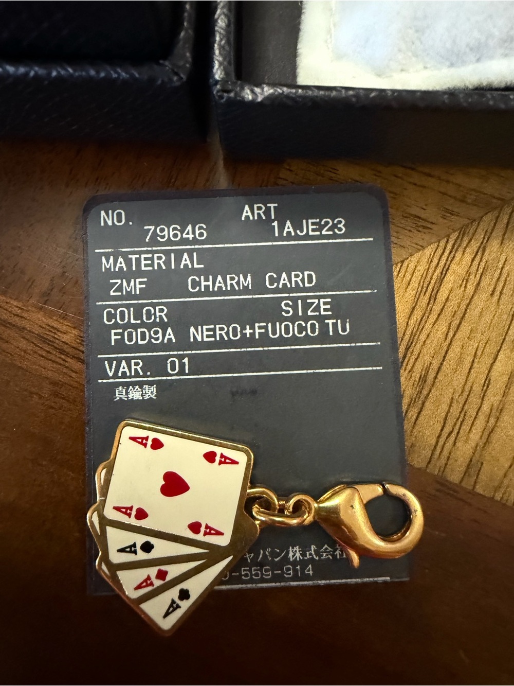 Prada Charm Card Keychain/Bag Charm - Gold with Black & Red Accents